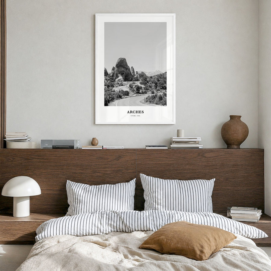 Arches National Park Classic Poster in a white wood frame, hanging in a bedroom