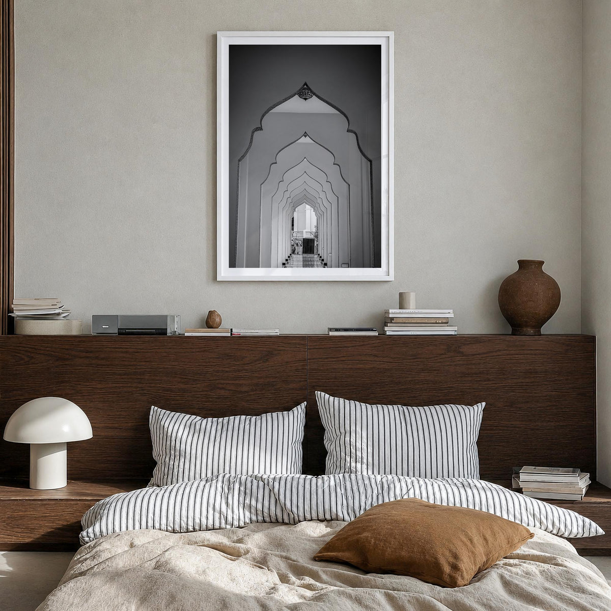 Archway no. 2 black & white photo poster – vertical wall art in white wood frame with white border, hanging on wall