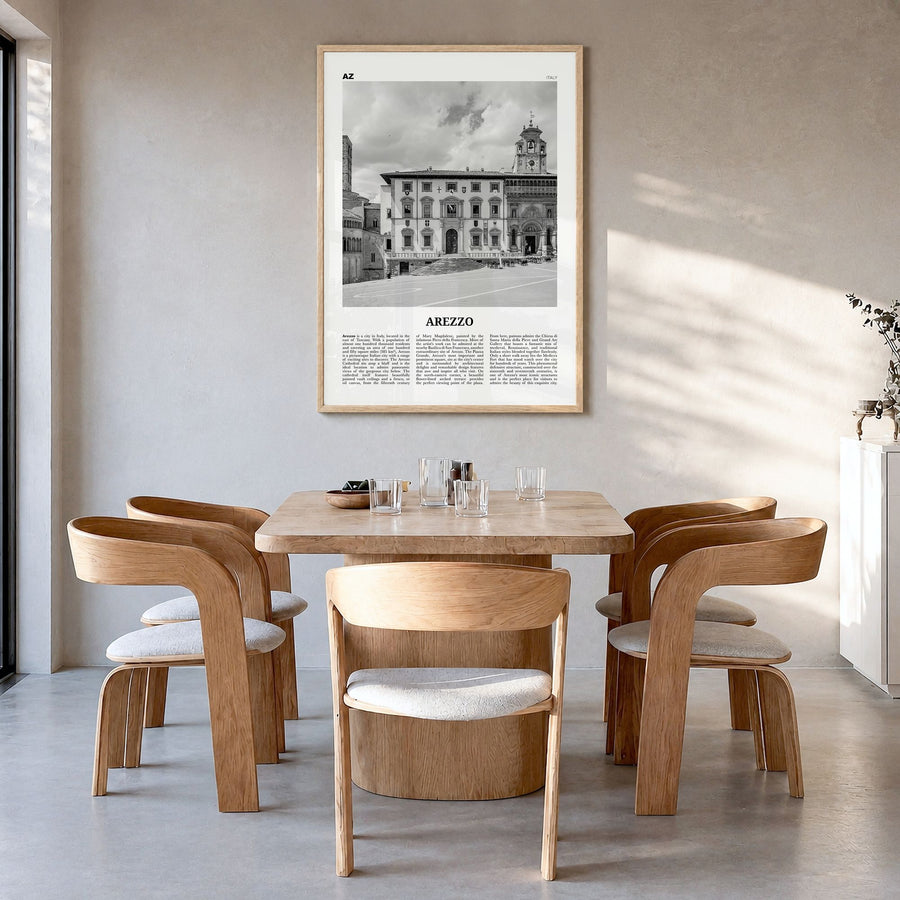 Arezzo Newspaper Poster in a natural wood frame, hanging in a dining room