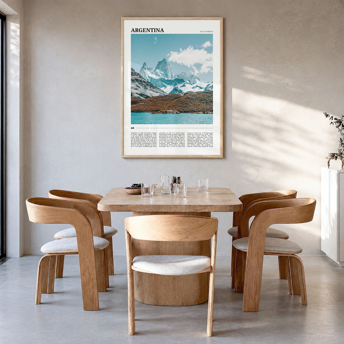 Argentina Travel Poster in a natural wood frame, hanging in a dining room
