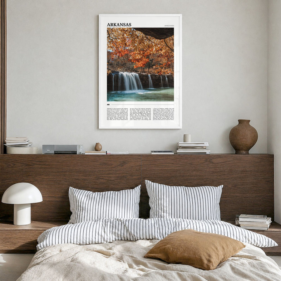 Arkansas Travel Poster in a white wood frame, hanging in a bedroom