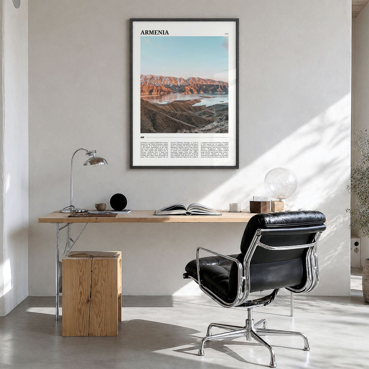 Armenia Travel Poster in a black wood frame, hanging in a bright home office