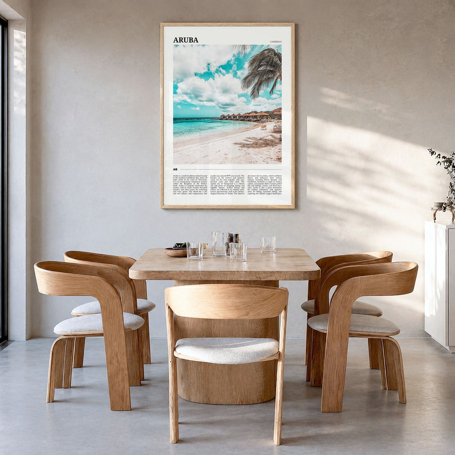 Aruba Travel Poster in a natural wood frame, hanging in a dining room