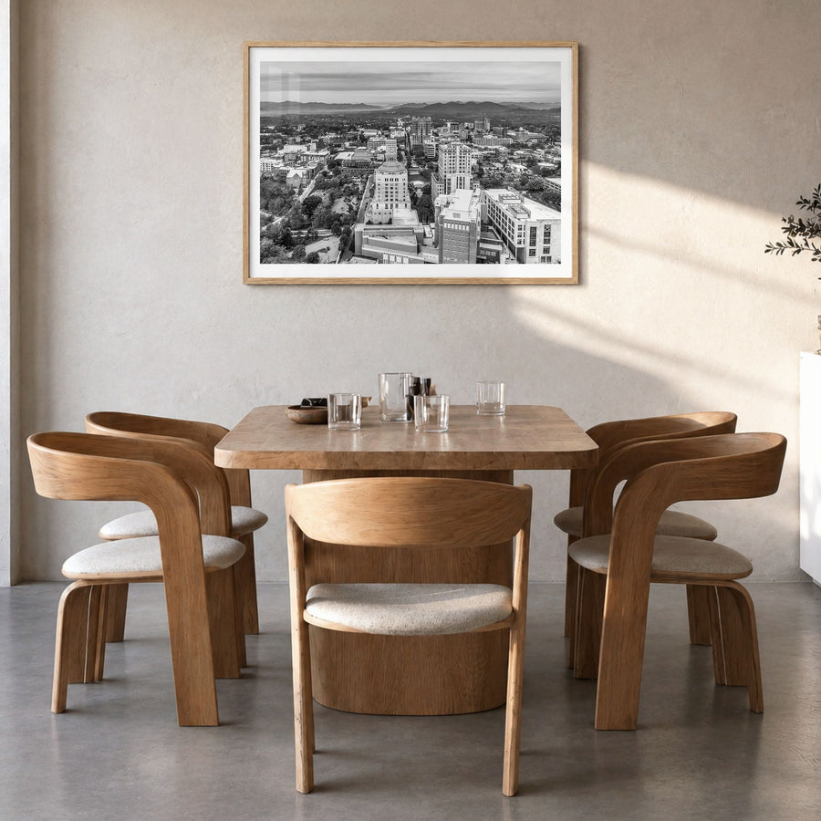 Asheville Photo Poster in a natural wood frame, hanging in a dining room, white border