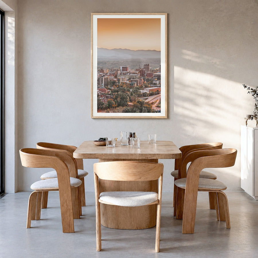 Asheville Photo No 1 Poster in a natural wood frame, hanging in a dining room, white border