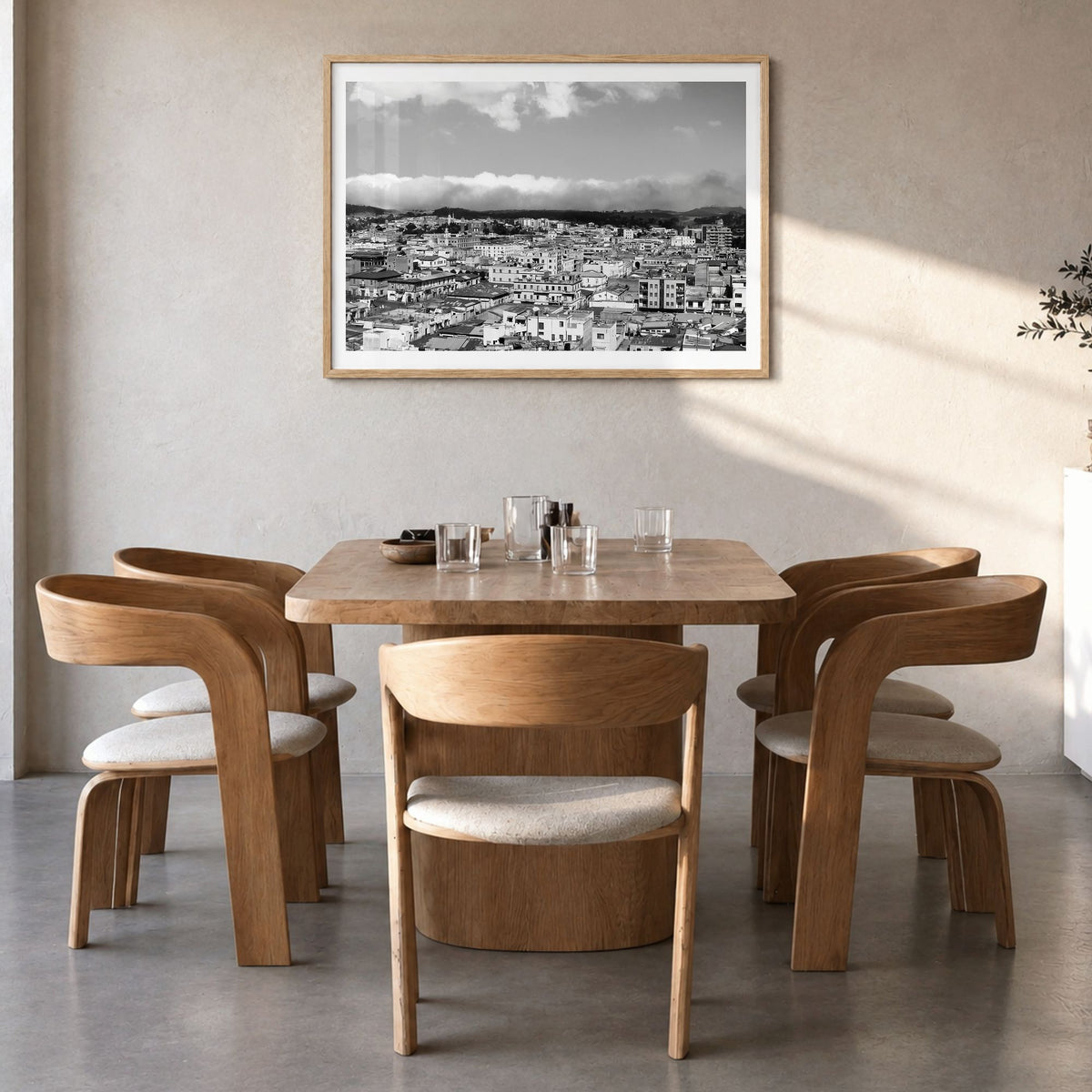 Asmara Photo Poster in a natural wood frame, hanging in a dining room, white border
