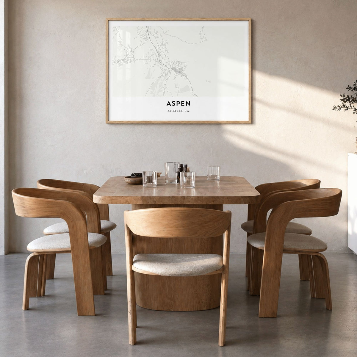 Aspen Map Poster in a natural wood frame, hanging in a dining room