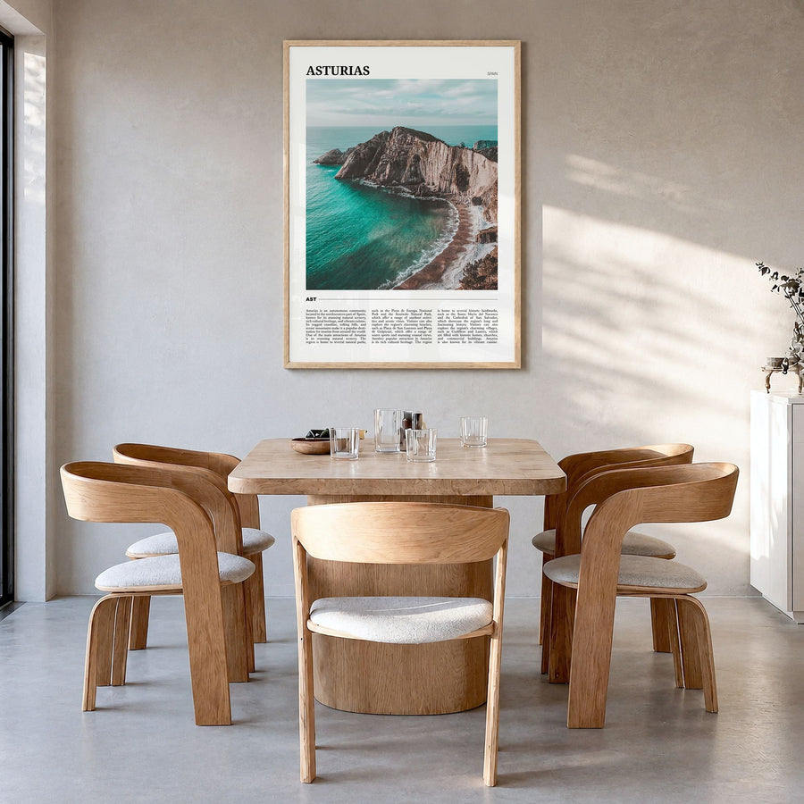 Asturias Travel Poster in a natural wood frame, hanging in a dining room