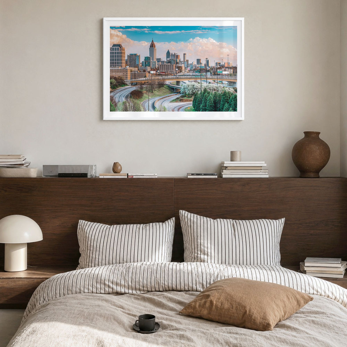 Atlanta Photo Poster in a white wood frame, hanging in a bedroom, white border