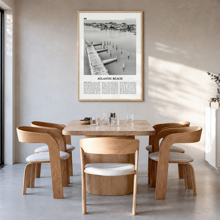Atlantic Beach Newspaper Poster in a natural wood frame, hanging in a dining room
