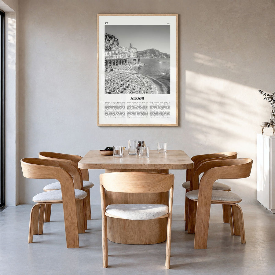 Atrani Newspaper Poster in a natural wood frame, hanging in a dining room