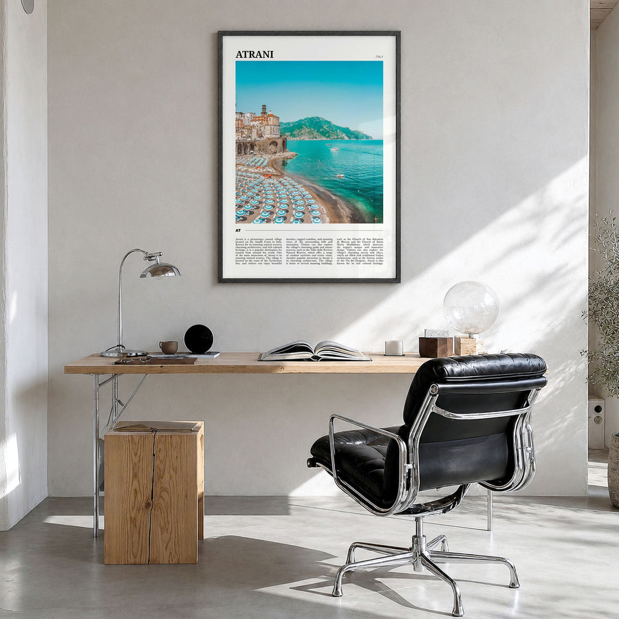 Atrani Travel Poster in a black wood frame, hanging in a bright home office