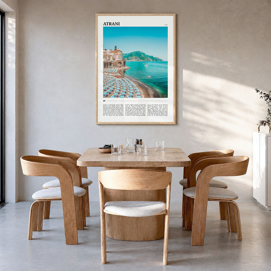Atrani Travel Poster in a natural wood frame, hanging in a dining room