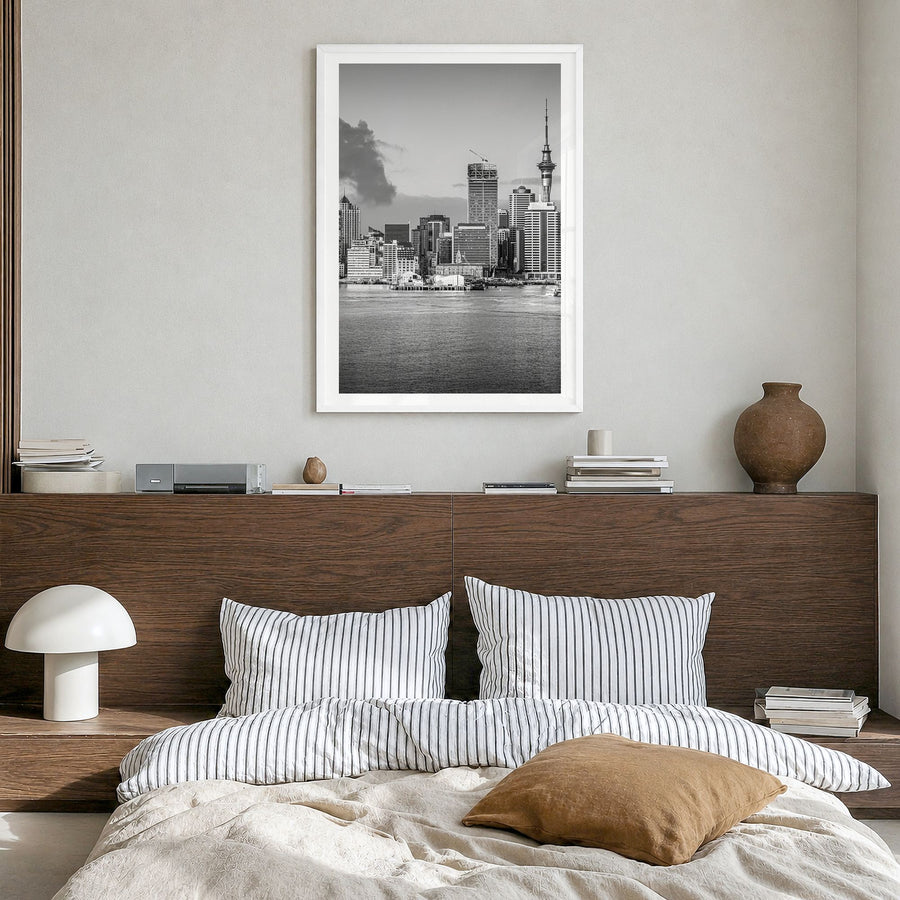 Auckland Photo Poster in a white wood frame, hanging in a bedroom, white border
