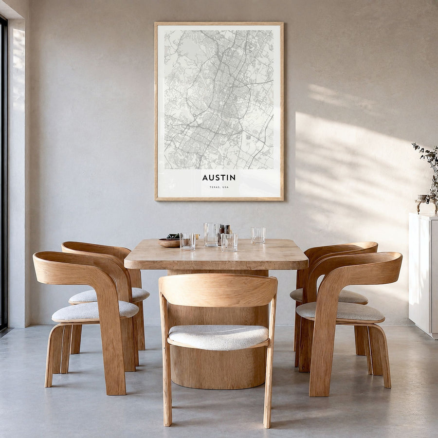 Austin Map Poster in a natural wood frame, hanging in a dining room
