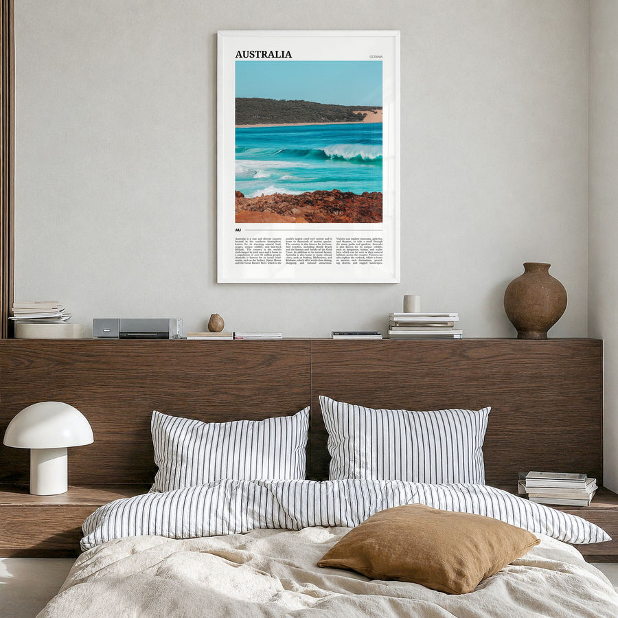 Australia Travel Poster in a white wood frame, hanging in a bedroom