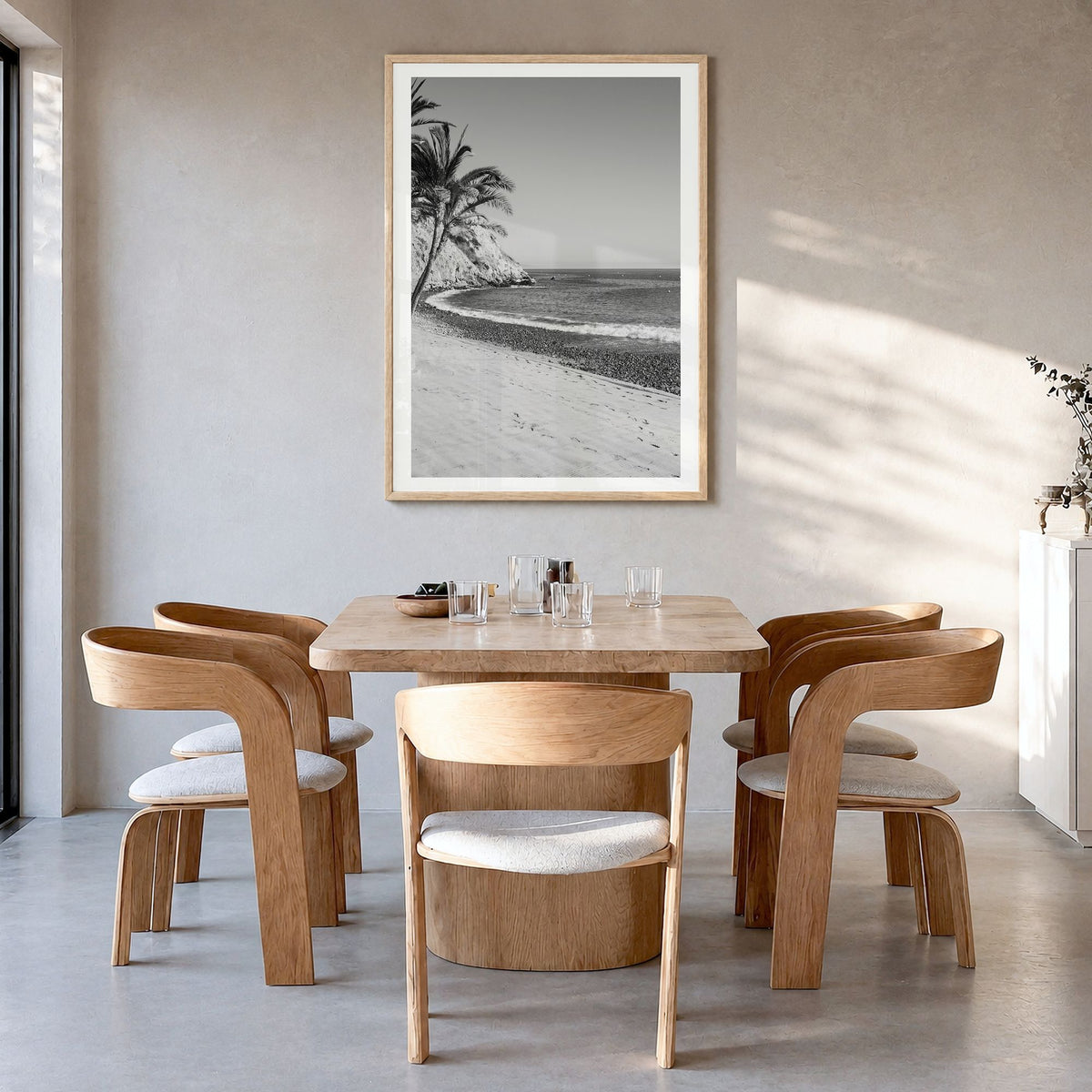 Avalon, California Photo Poster in a natural wood frame, hanging in a dining room, white border