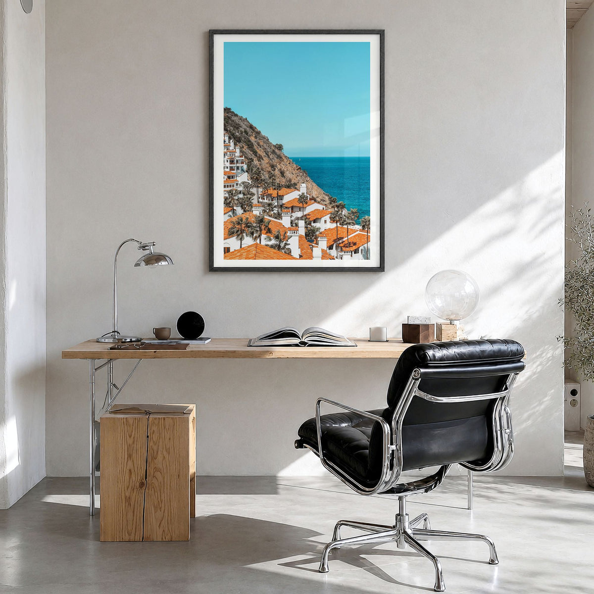Avalon, California Photo Poster in a black wood frame, hanging in a bright home office, white border
