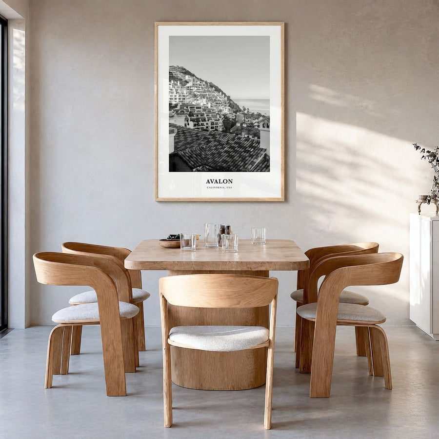Avalon, California Classic Poster in a natural wood frame, hanging in a dining room