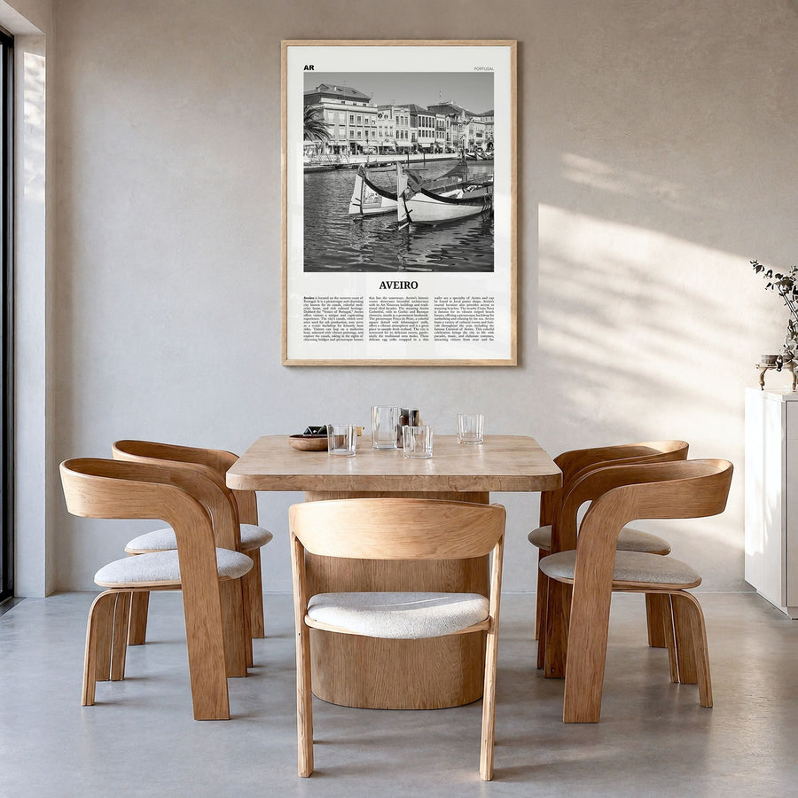 Aveiro Newspaper Poster in a natural wood frame, hanging in a dining room