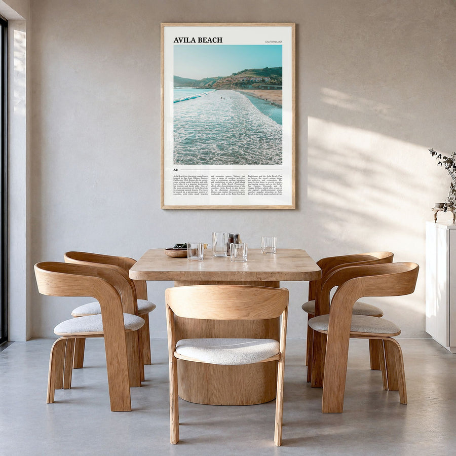 Avila Beach Travel Poster in a natural wood frame, hanging in a dining room