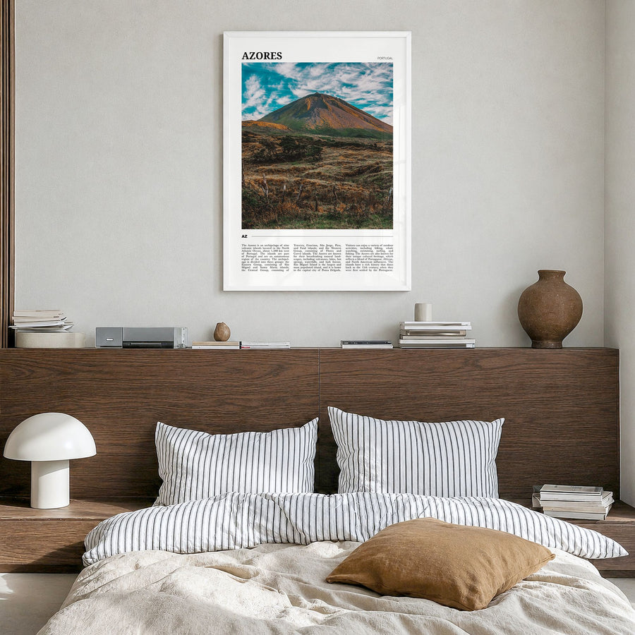 Azores Travel Poster in a white wood frame, hanging in a bedroom