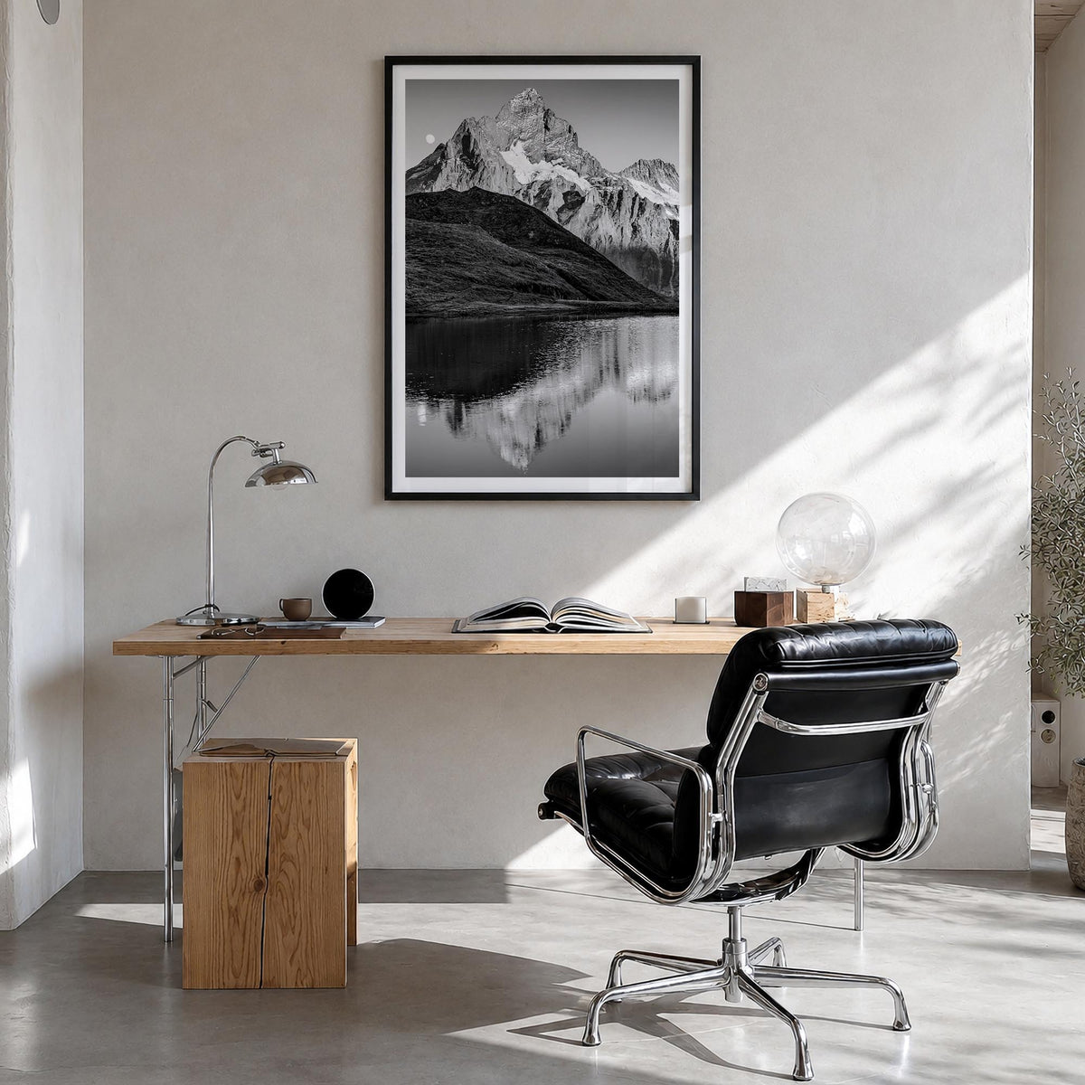 Bachalpsee black & white photo poster of Switzerland – vertical wall art in black wood frame with white border, hanging on wa