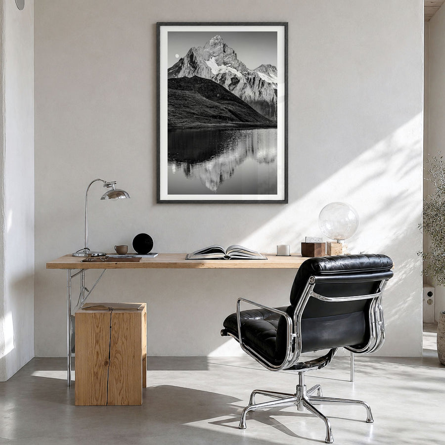 Bachalpsee Photo Poster in a black wood frame, hanging in a bright home office, white border