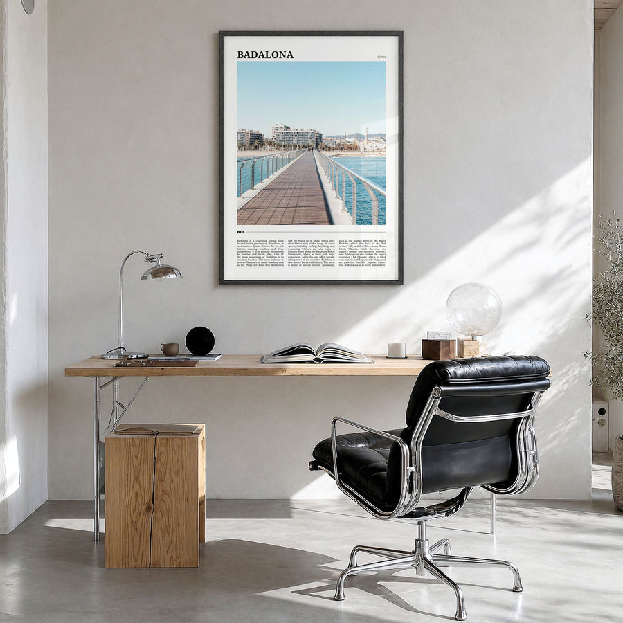 Badalona Travel Poster in a black wood frame, hanging in a bright home office