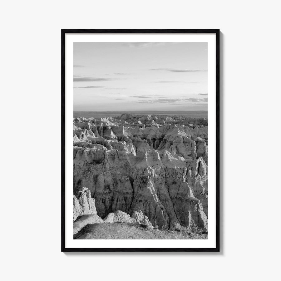 Badlands National Park black & white photo poster of South Dakota, USA – vertical wall art, unframed print shown in interior 