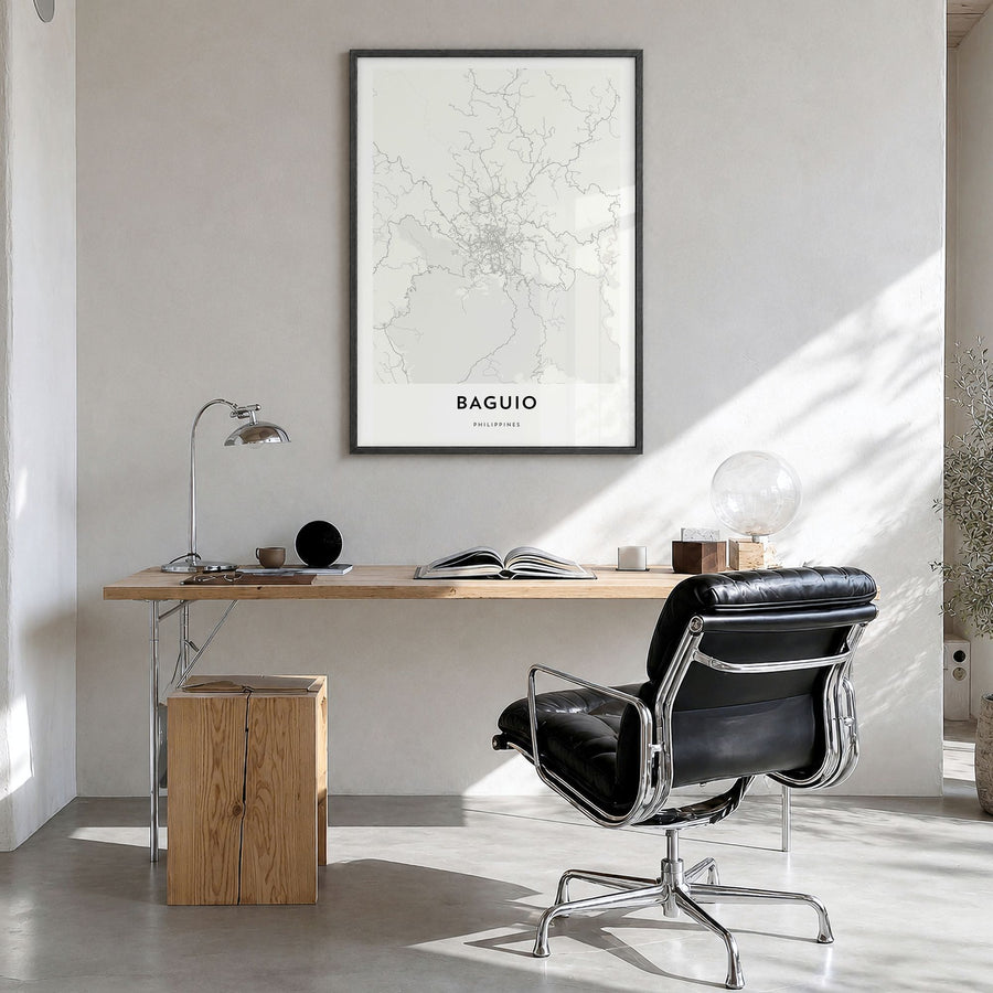Baguio Map Poster in a black wood frame, hanging in a bright home office