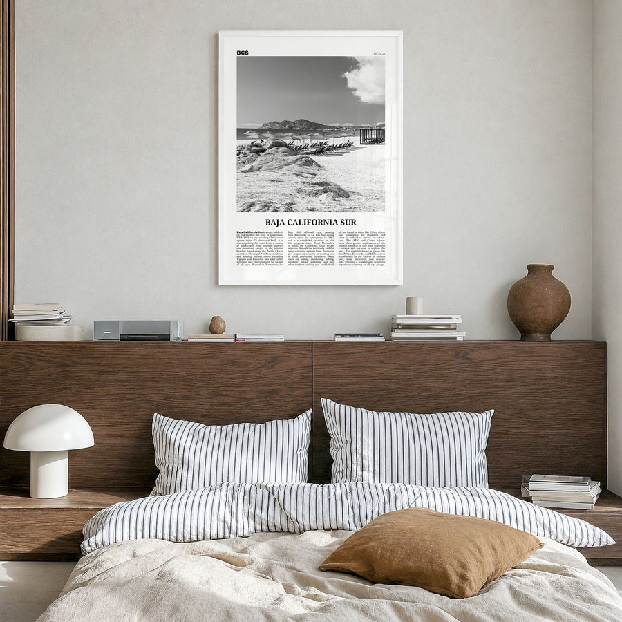 Baja California Sur Newspaper Poster in a white wood frame, hanging in a bedroom