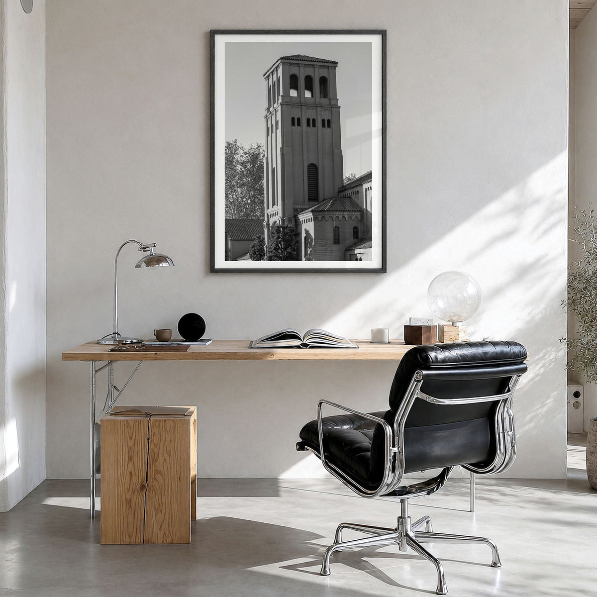 Bakersfield Photo Poster in a black wood frame, hanging in a bright home office, white border