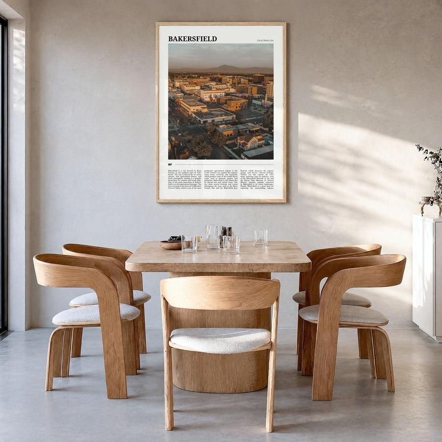 Bakersfield Travel Poster in a natural wood frame, hanging in a dining room