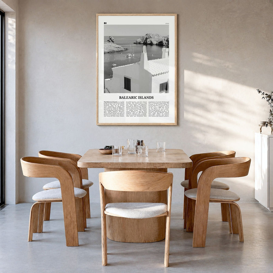 Balearic Islands Newspaper Poster in a natural wood frame, hanging in a dining room