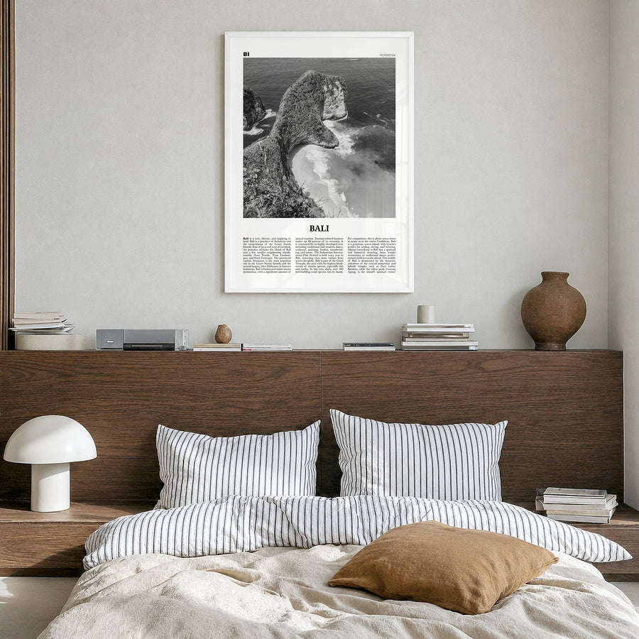 Bali Newspaper No 3 Poster in a white wood frame, hanging in a bedroom