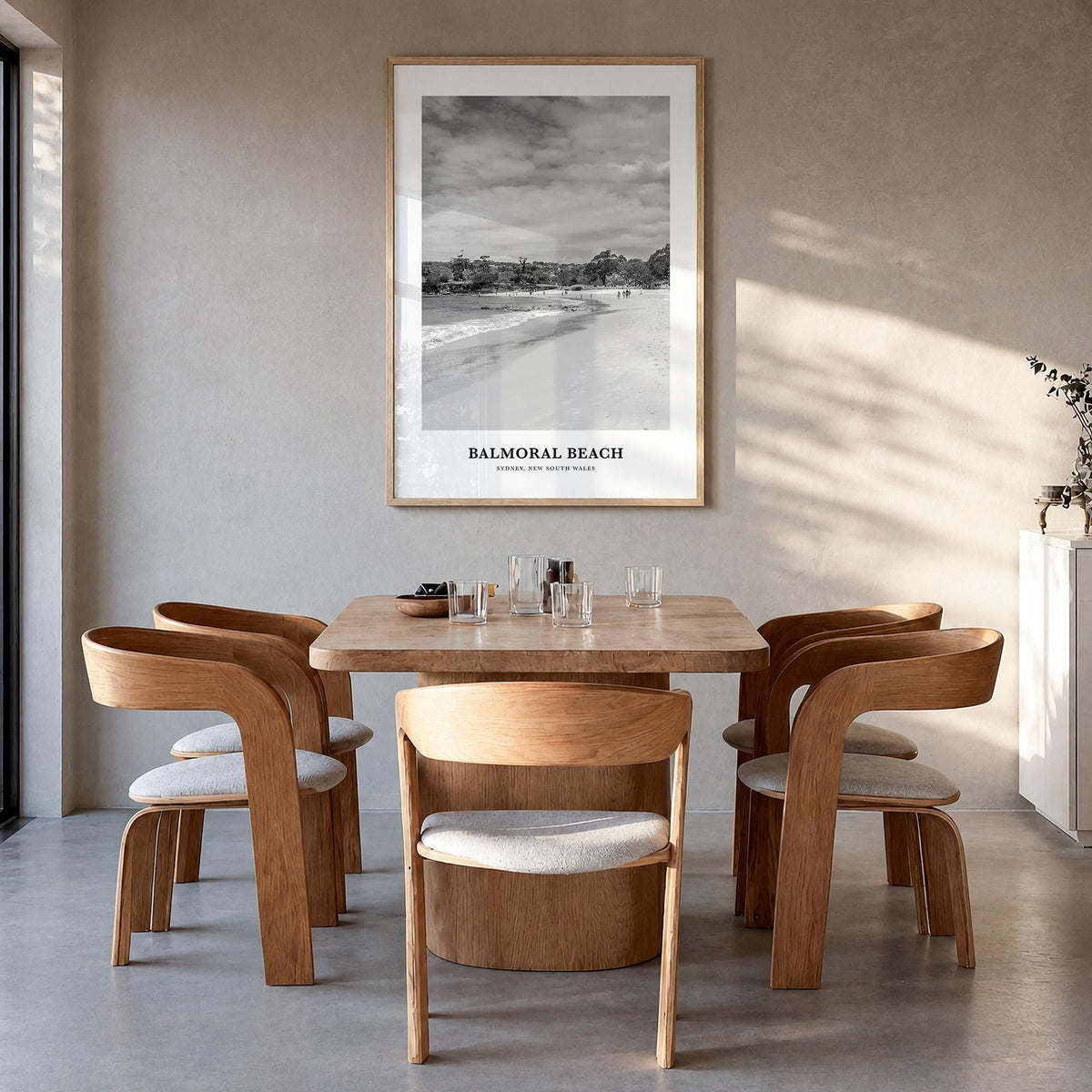 Balmoral Beach black & white classic poster of Australia – vertical wall art in natural wood frame, hanging on wall