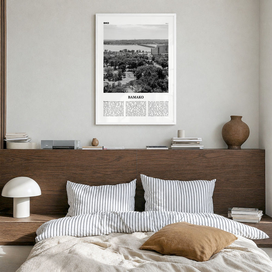 Bamako Newspaper Poster in a white wood frame, hanging in a bedroom