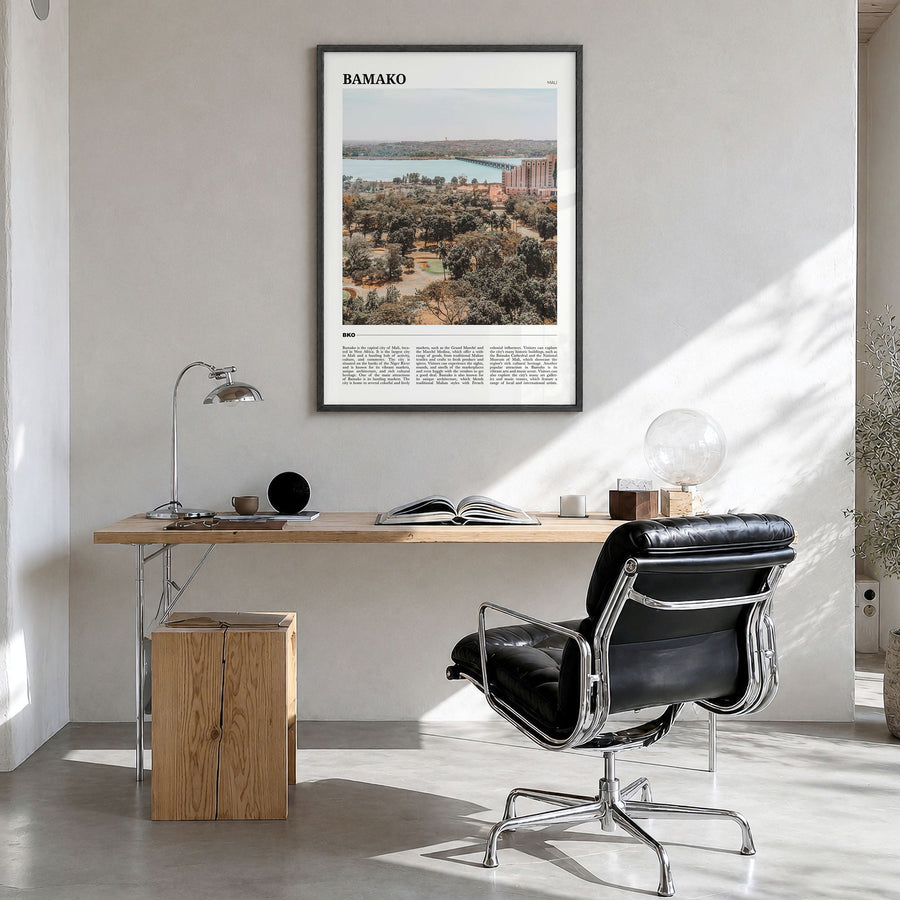Bamako Travel Poster in a black wood frame, hanging in a bright home office