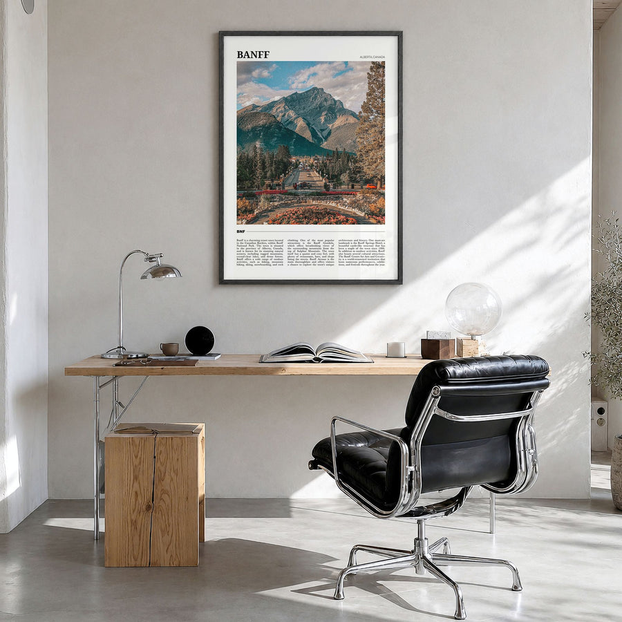 Banff Travel Poster in a black wood frame, hanging in a bright home office