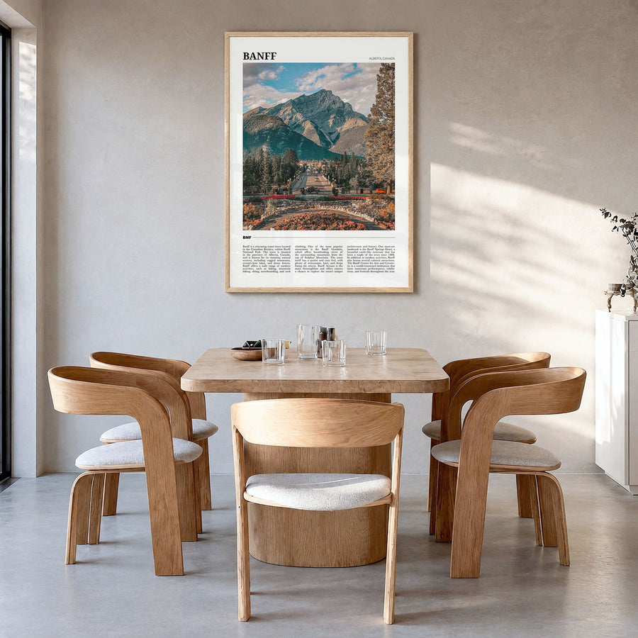 Banff Travel Poster in a natural wood frame, hanging in a dining room