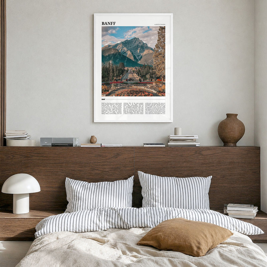 Banff Travel Poster in a white wood frame, hanging in a bedroom