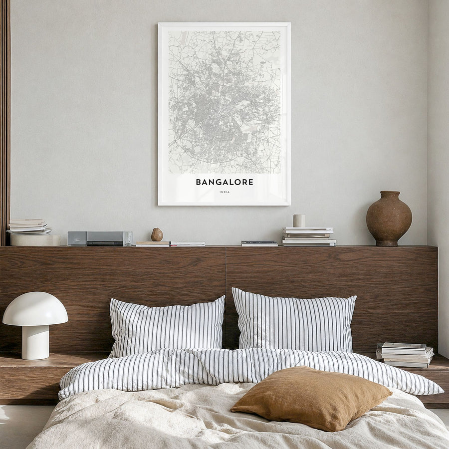 Bangalore Map Poster in a white wood frame, hanging in a bedroom