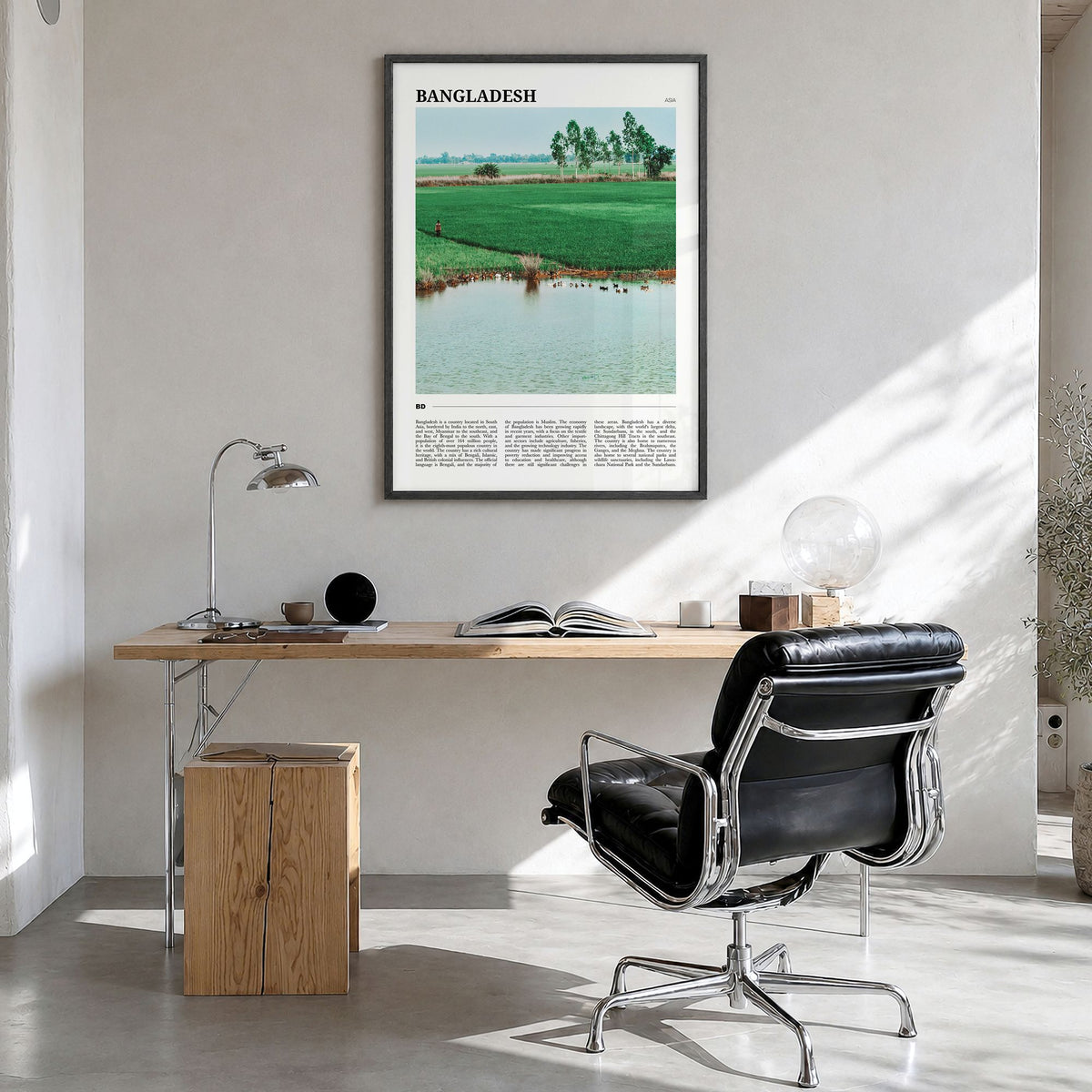 Bangladesh Travel Poster in a black wood frame, hanging in a bright home office