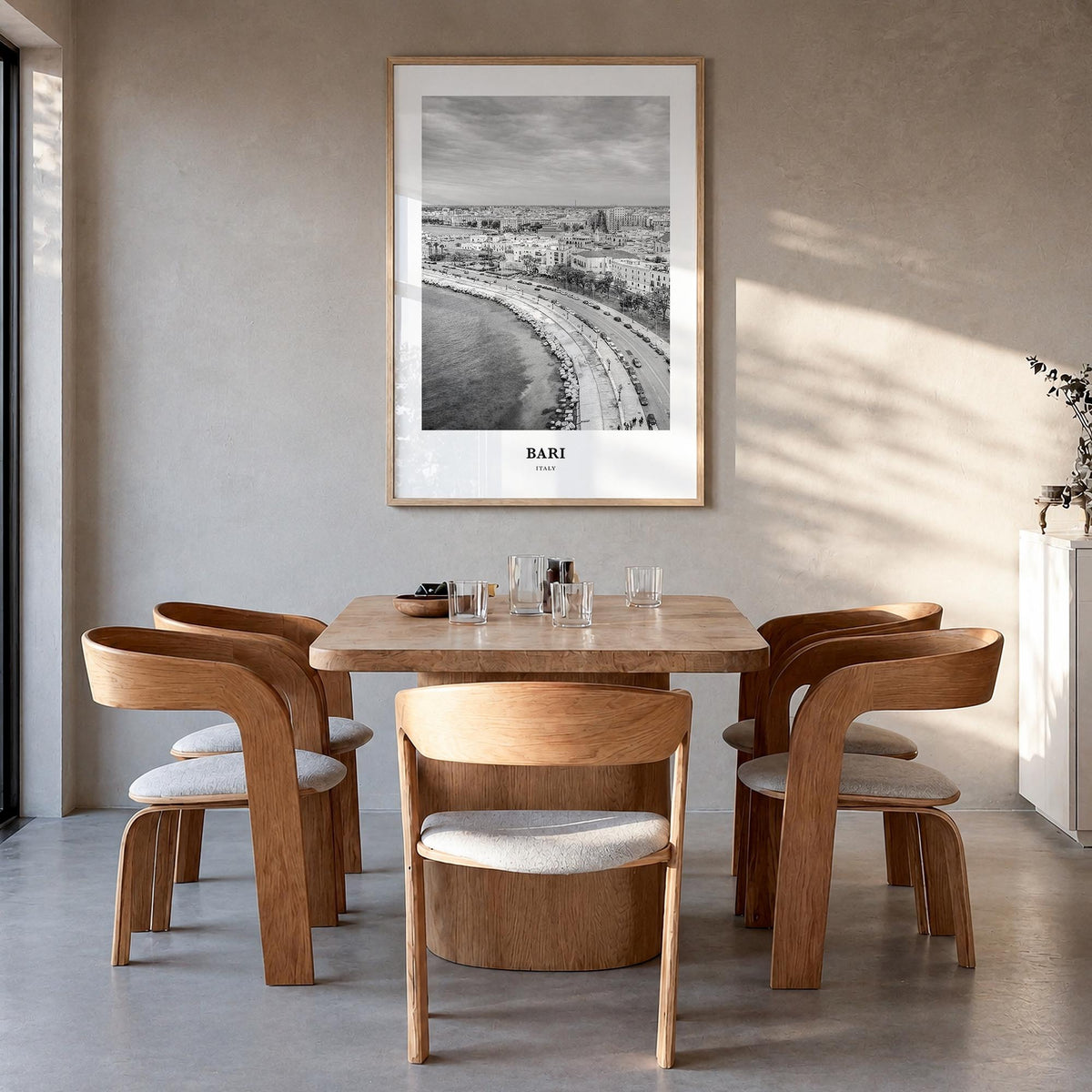 Bari black & white classic poster of Italy – vertical wall art in natural wood frame, hanging on wall