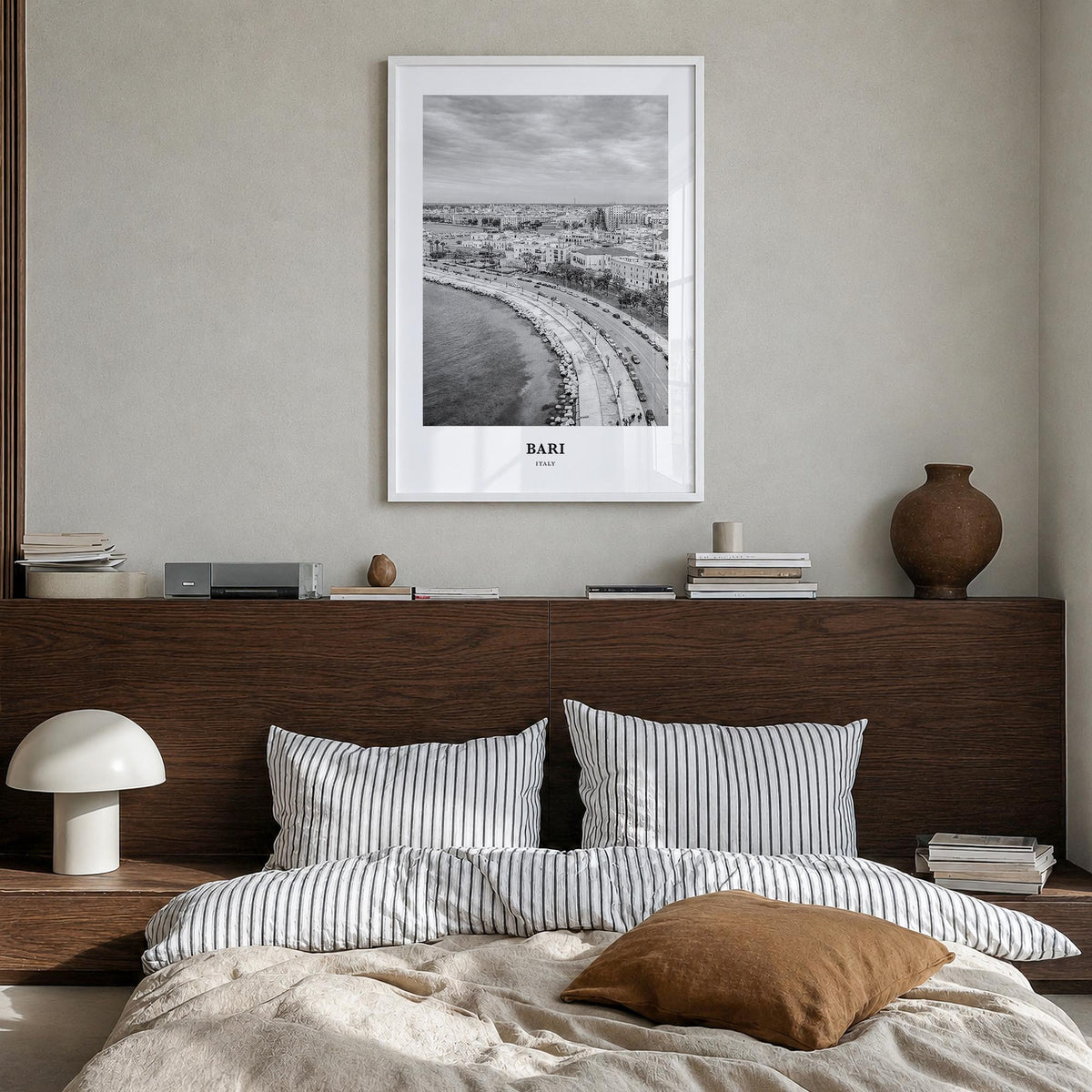 Bari black & white classic poster of Italy – vertical wall art in white wood frame, hanging on wall