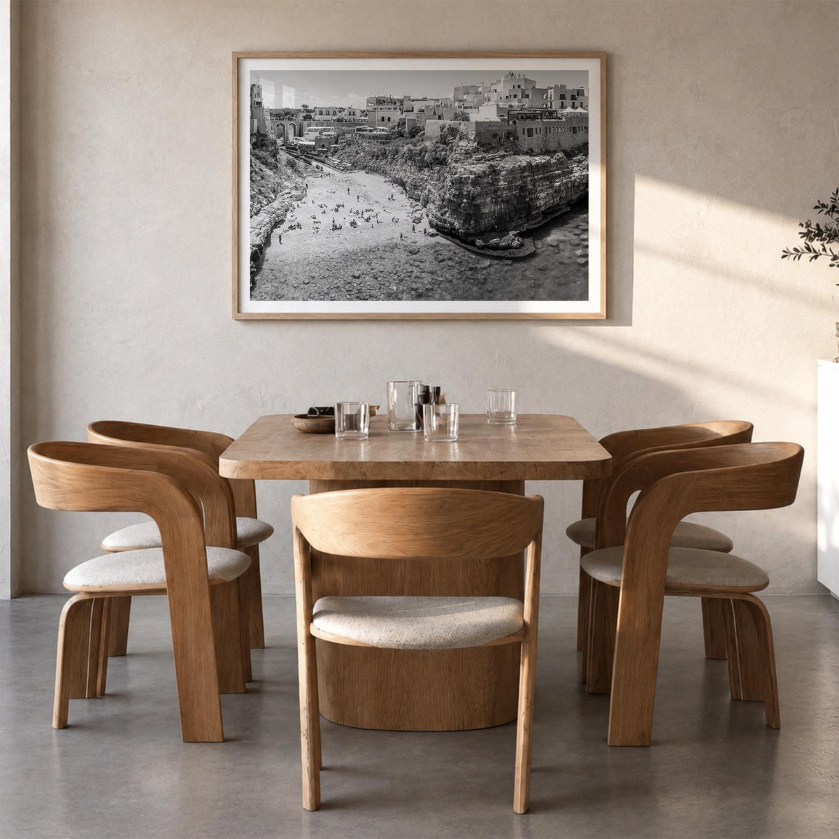 Bari black & white photo poster of Italy – horizontal wall art in natural wood frame with white border, hanging on wall