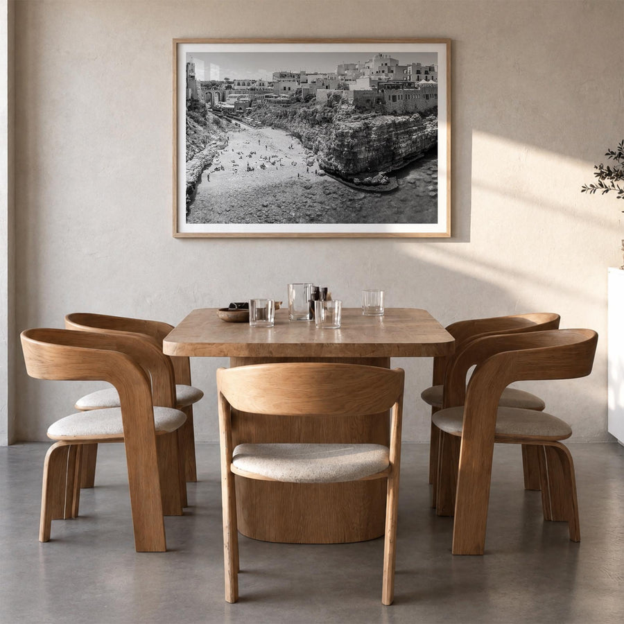 Bari black & white photo poster of Italy – horizontal wall art in natural wood frame with white border, hanging on wall