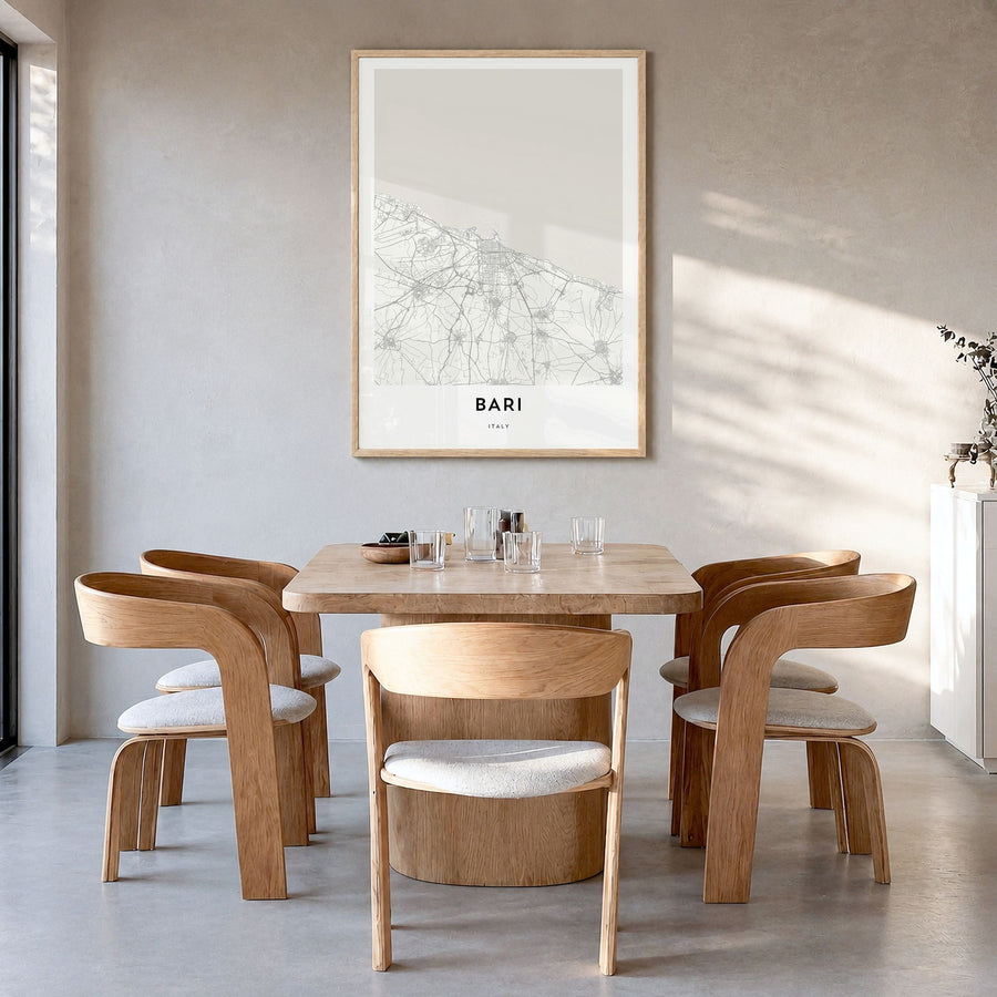 Bari Map Poster in a natural wood frame, hanging in a dining room