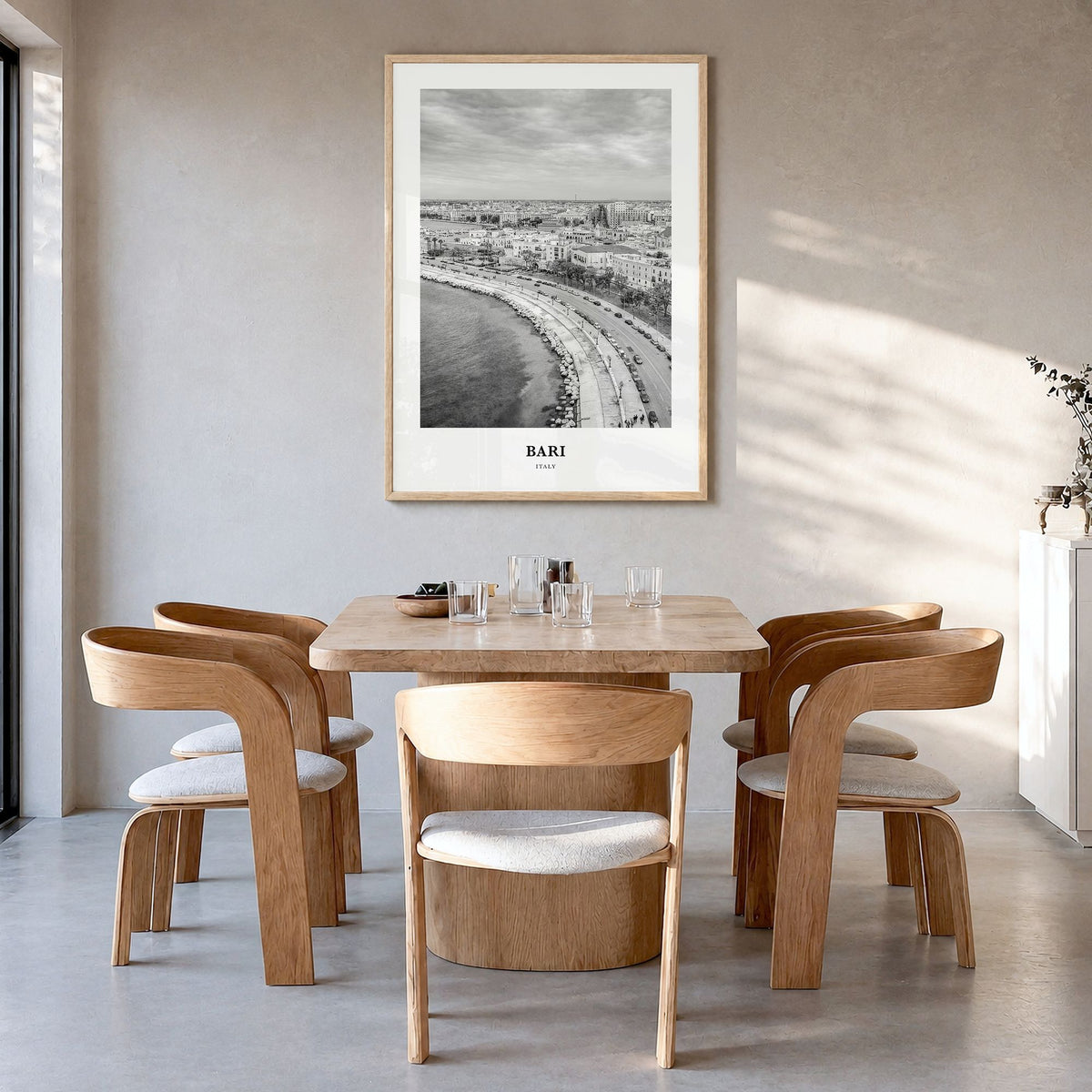 Bari Classic Poster in a natural wood frame, hanging in a dining room